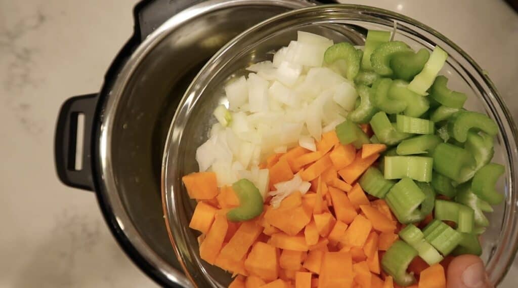 Adding veggies to pot