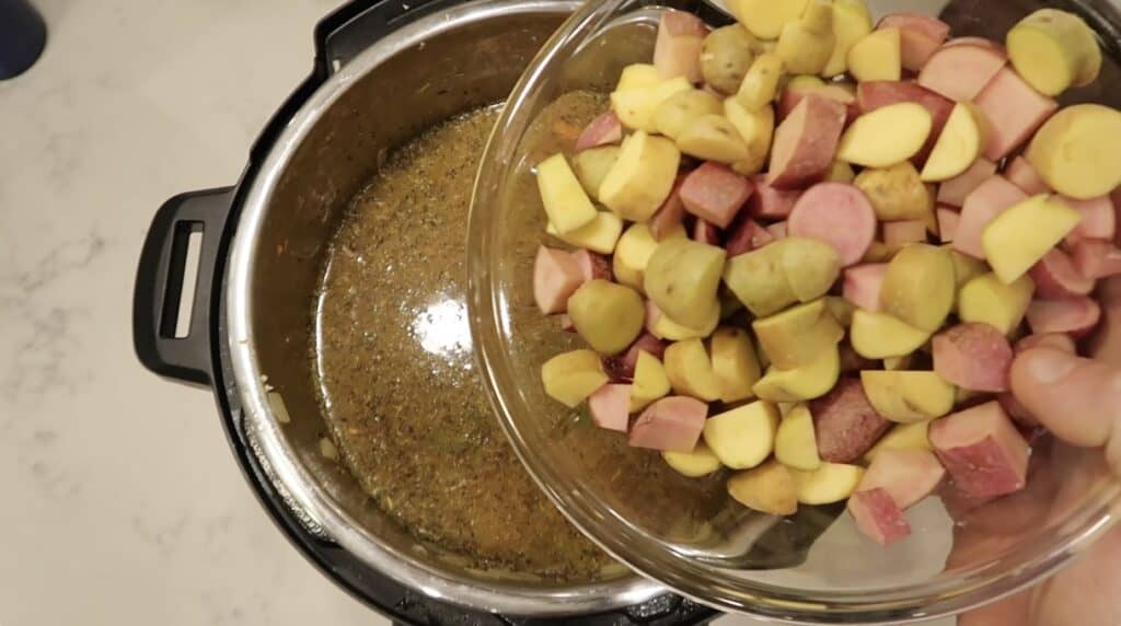 Adding potatoes to pot